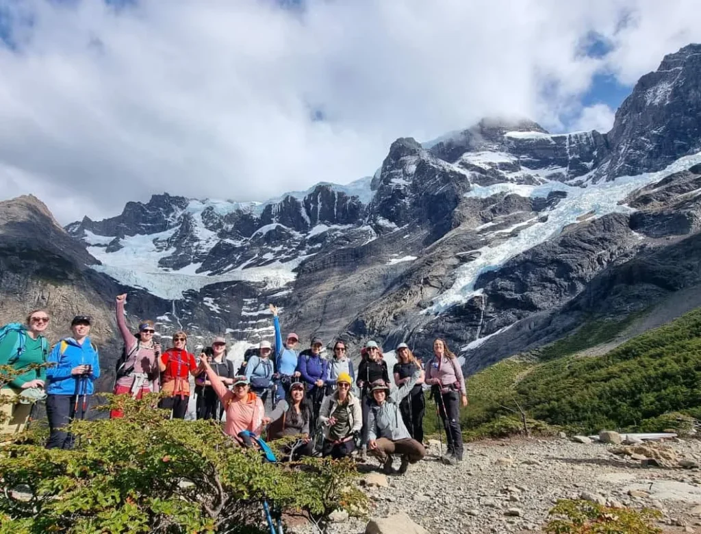 Hikers in French Valley with Paine Grande and the hanging glaciers of the French Glacier in Torres del Paine National Park.