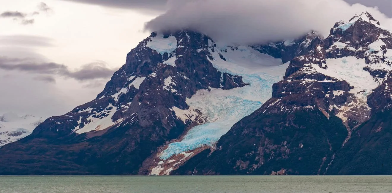 Balmaceda Glacier hanging from the mountain above the Última Esperanza fjord, near Puerto Natales