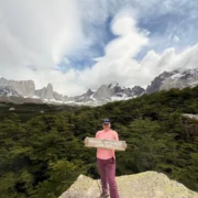 Traveler in the French Valley, surrounded by forest and mountain views in Torres del Paine.
