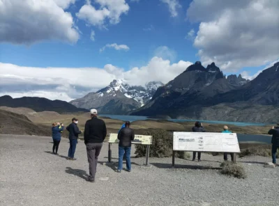 Group of travelers enjoying a scenic viewpoint in Torres del Paine