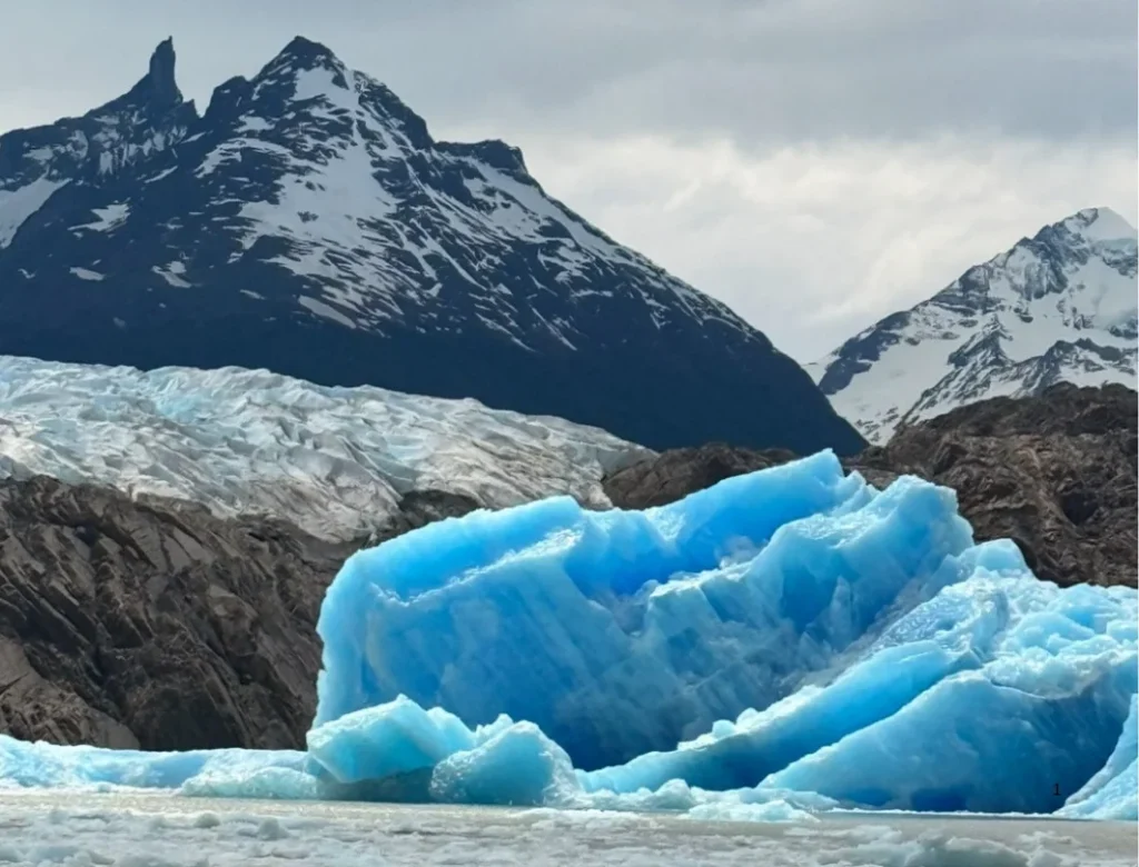 Blue iceberg floating on Grey Lake near Grey Glacier in Torres del Paine National Park.