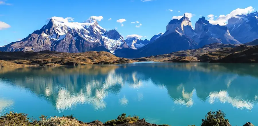 loscuernosreflect Los Cuernos mountains reflected in a turquoise lake in Torres del Paine