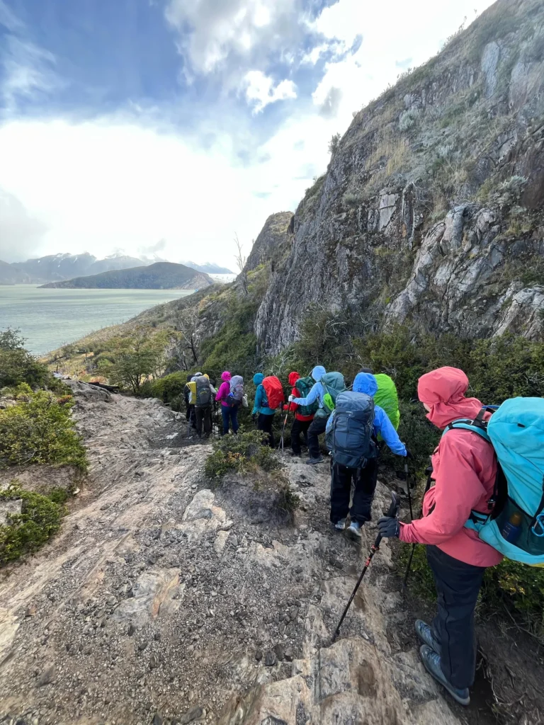 Guided group hiking the W Trek trail above Lake Nordenskjöld, Torres del Paine National Park