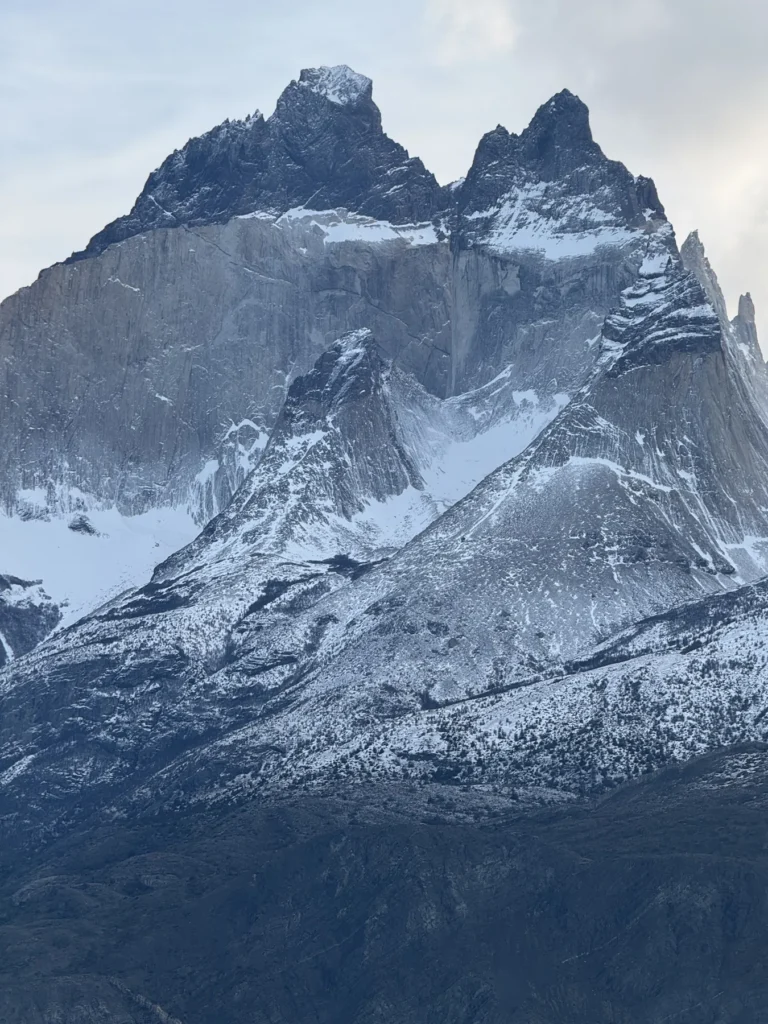 The Cuernos del Paine under winter snow above the lake, Torres del Paine
